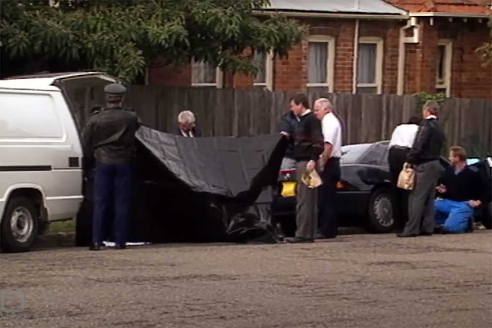 Detectives photographed at the Mosman crime scene on July 4, 1991.