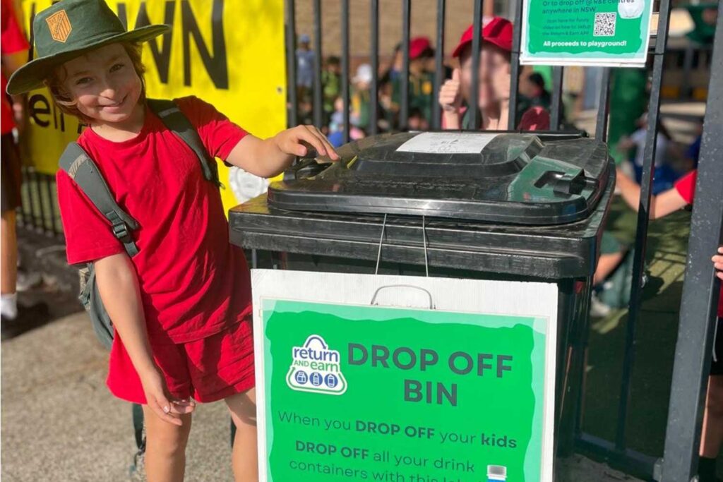 Cammeray Public School student with the Return and Earn recycling bin