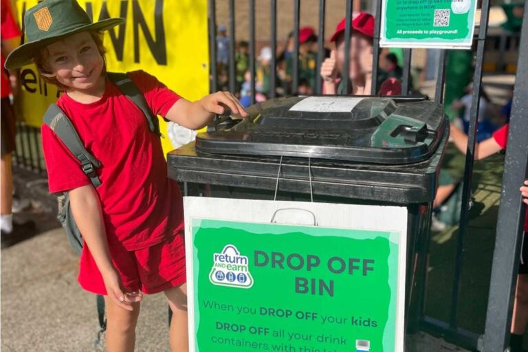 Cammeray Public School student with the Return and Earn recycling bin