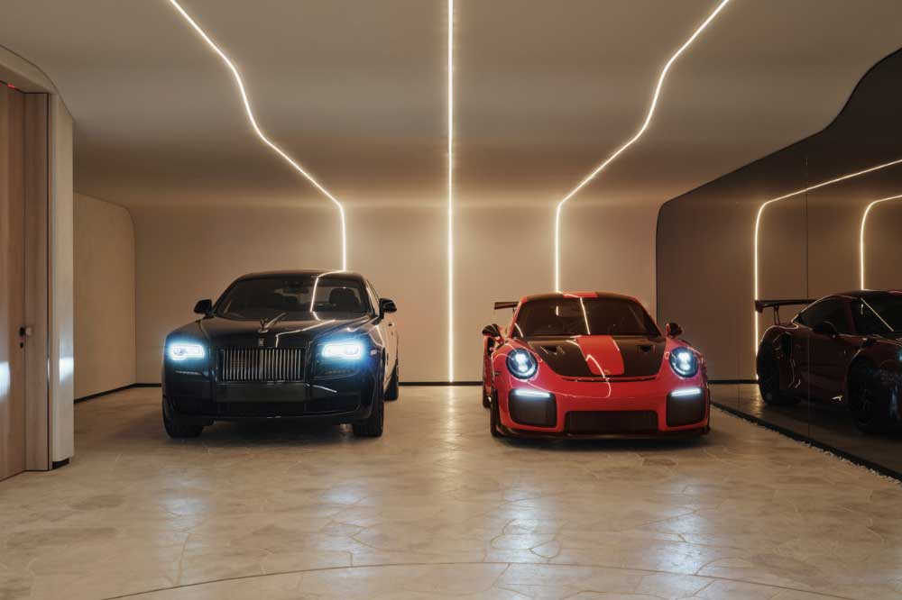 The garage is another highlight, offering multi-car parking and a turntable.