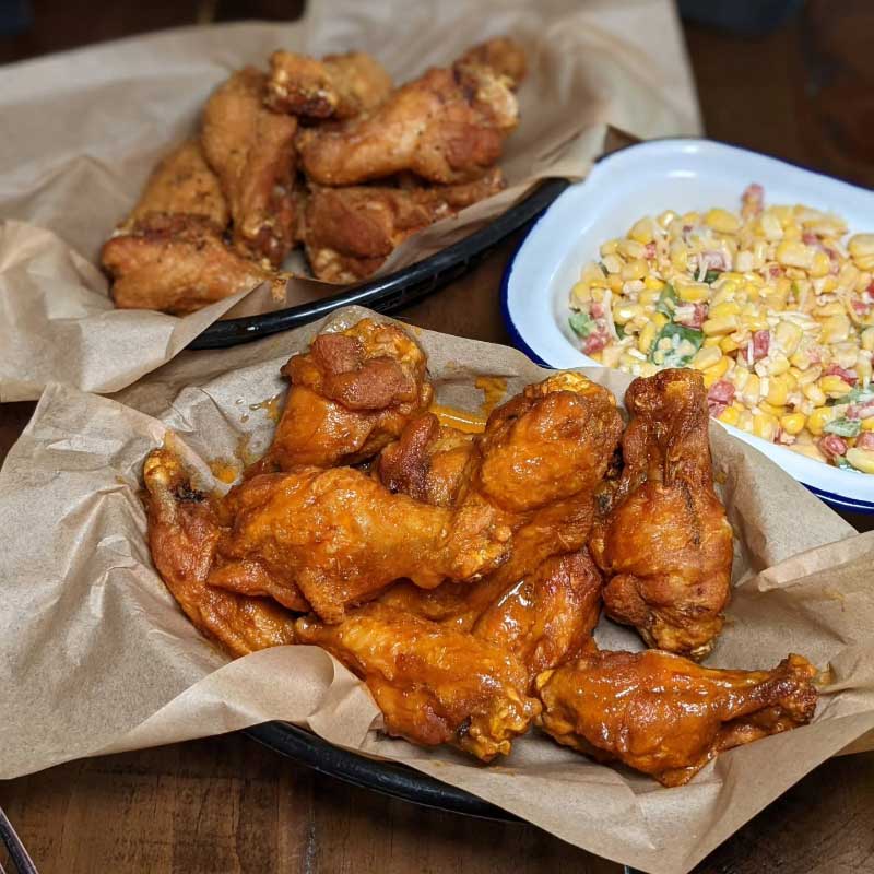 Chicken wings and corn from the Chico's menu, from the team behind WingMill.
