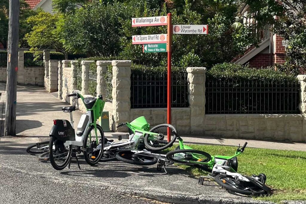 Lime Bikes dumped on a lower north shore footpath. A new $6.6m state crackdown gives councils power to clamp down.