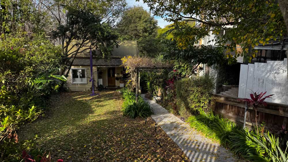forgot-2 A leafy backyard and cottage behind a Raglan Street house at Mosman.