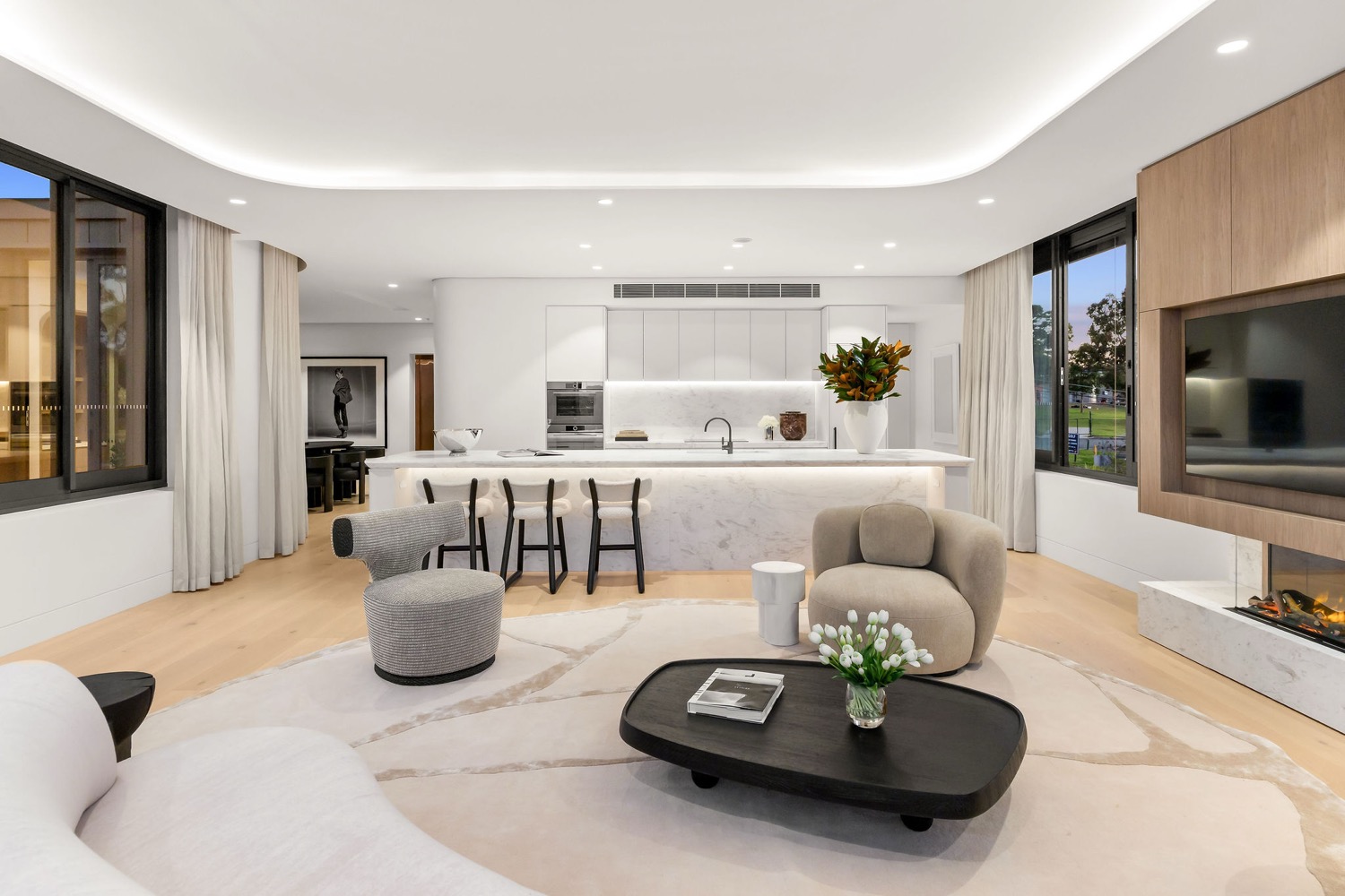 The open plan living, dining and chef's kitchen inside the Park Residences penthouse at Cremorne.