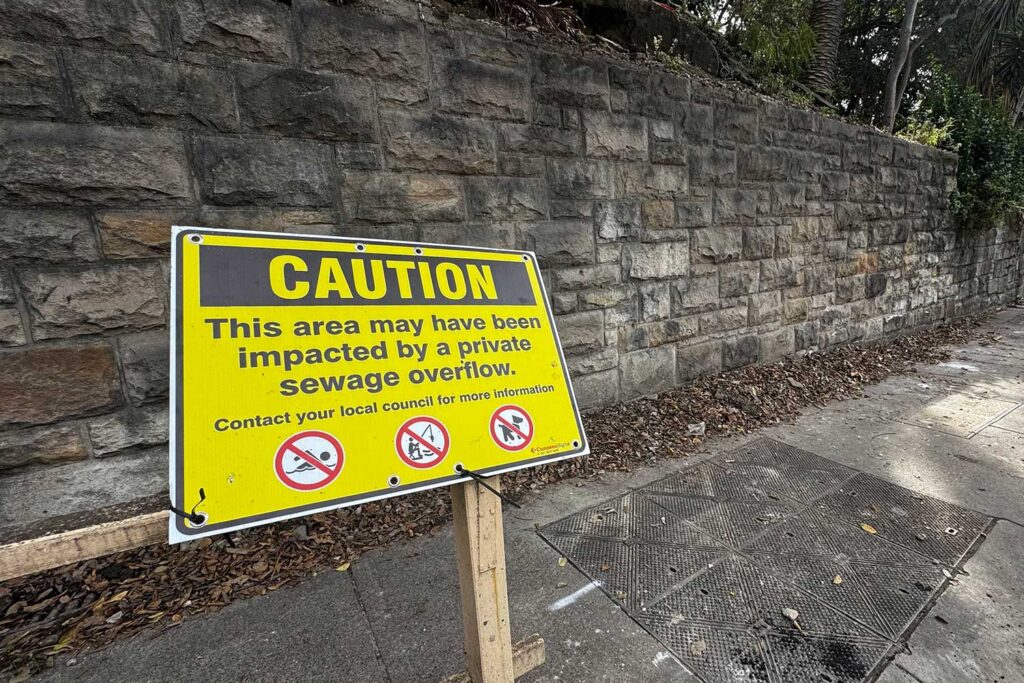 Caution sign in regards to raw sewage