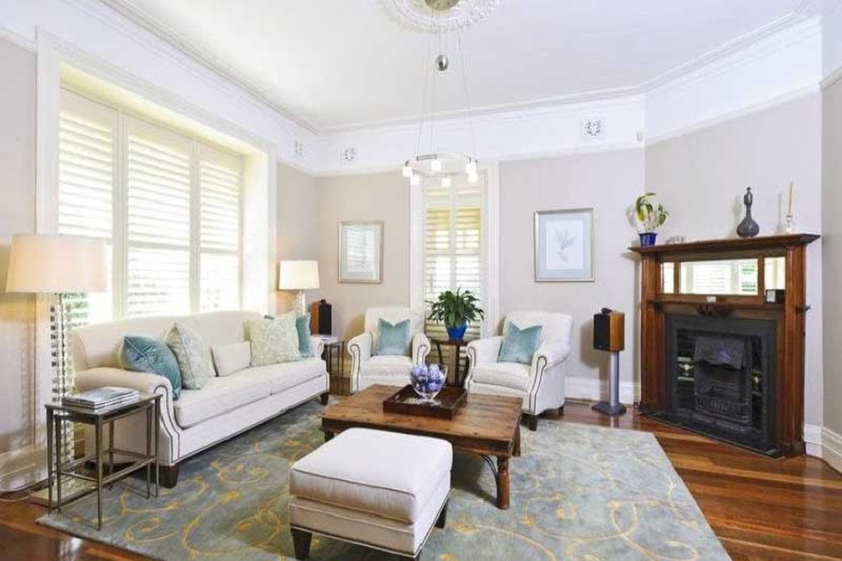 Inside one of the Mosman homes on the super site, with a period ceiling rose and fireplace.