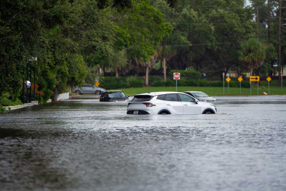 Cars under water in flooded street