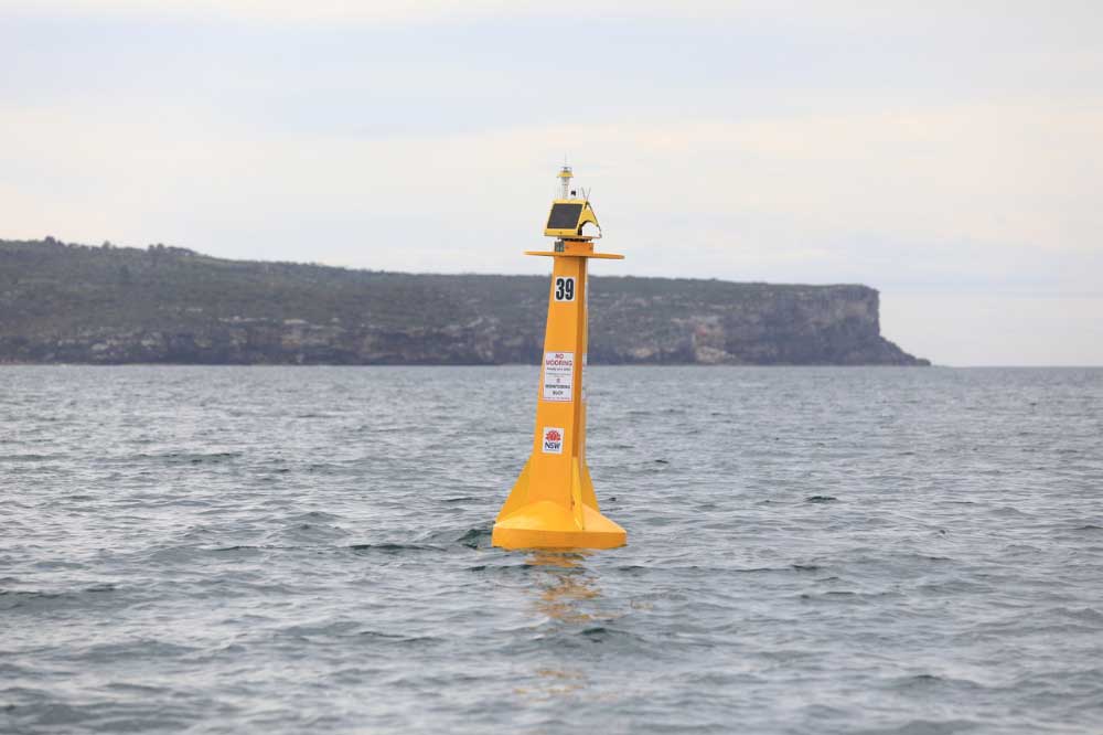 Shark listening device installed just inside North Head in choppy ocean.