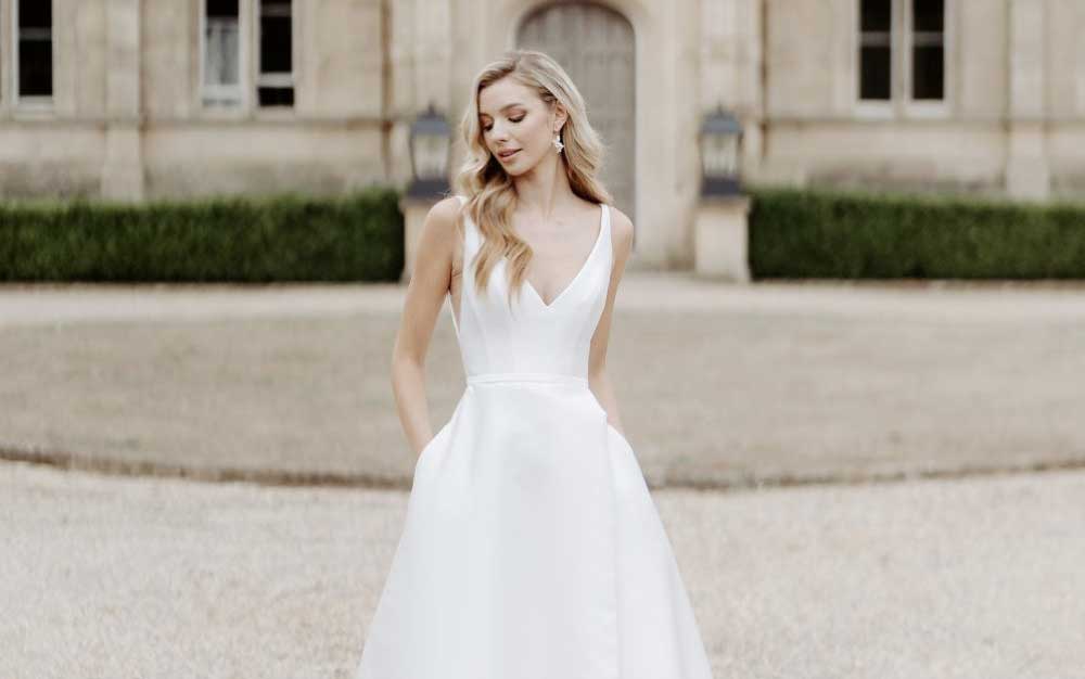 Beautiful bride outside church in white dress Beautiful bride outside church in white dress