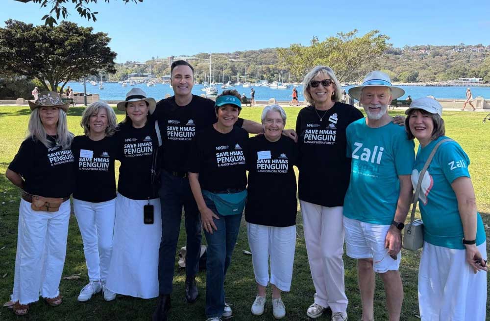 group of supporters wearning HMAS Penguin shirts